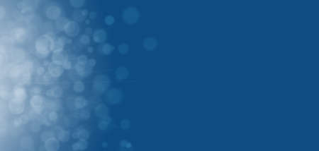 Bokeh on classic blue holiday background. Horizontal wide screen banner formatの写真素材