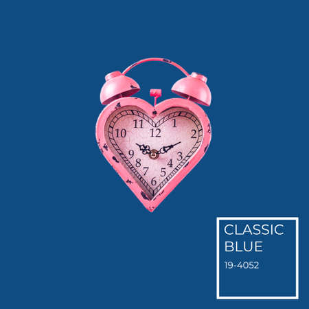 Heart shaped pink clock on classic blue background. Valentines day and love infitity and duration concept. Square with color name tagの写真素材