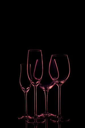 Glassware selection with wine, champagne and liquour glasses on the dark background.. Fine cristal glassware concept. Verticalの写真素材