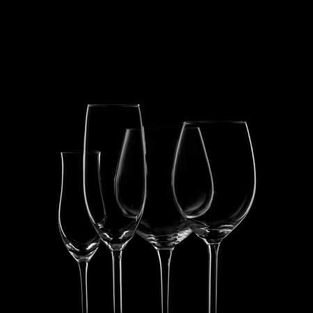 Glassware selection with wine, champagne and liquour glasses on the dark background.. Fine cristal glassware concept. Horizontalの写真素材