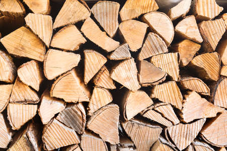 Texture of light stack of wood. Natural cozy background concept with place for text in horizontal formatの写真素材