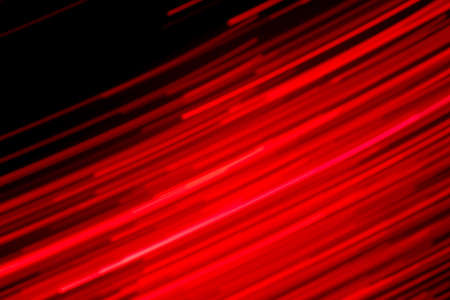 Futuristic blurred lights holiday monochrome background in saturated red and black, perfect for Christmas, New Year, Valentine, party, technology drop. Horizontal, soft focusの写真素材
