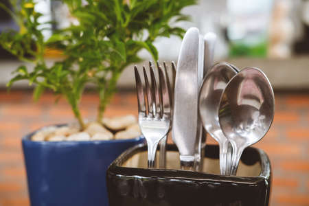 Cutlery set creatively placed on the restaurant table. Modern design hipster concept, soft focusの写真素材