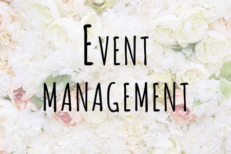 Trendy luxury pastel colored flower wall for celebrations, with Event management wording. Holiday, wedding, celebration conceptの写真素材