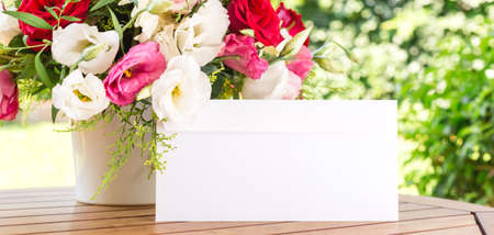 Bunch of flowers in reusable vase. Holiday, celebration, romance, online order and contactless delivery concept. Place for text on wide screen banner formatの写真素材