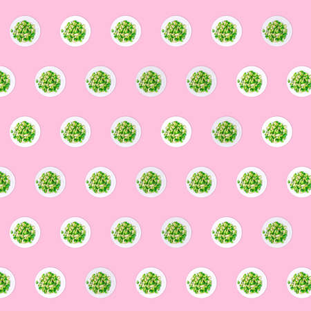 Pattern of plates with lightly fried brussels sprouts on the neon pink drop. Easy cooking, healthy eating, cooking at home, vegetarian and vegan concepts in creative trendy way. Banner formatの写真素材