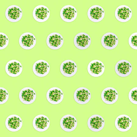 Pattern of plates with lightly fried brussels sprouts on the neon green drop. Easy cooking, healthy eating, cooking at home, vegetarian and vegan concepts in creative trendy way. Banner formatの写真素材