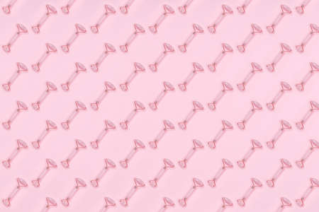 Pattern of jade rollers on pink drop. Beauty and self care, time for self, girly time concept. Place for textの写真素材