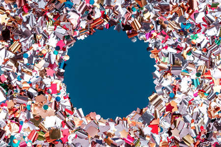 Round confetti frame on classic blue. Perfect background for any holiday project, place for text. Horizontalの写真素材