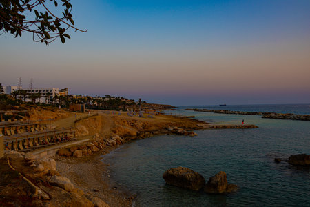 Sunset over village Chlorakas in Cyprus. Mediterranean sea and promenadeの写真素材