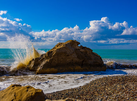 Splashing of waves on a stoneの写真素材