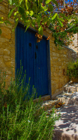 Close-up view on blue wooden door in Lofou village in Cyprusの写真素材