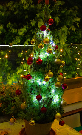 Fir tree with Xmas balls and garland. new year and Christmas decorの写真素材