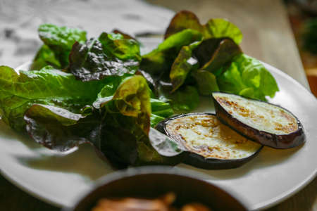 Healthy food in the village with natural products on wooden table close up. Morning different ingredient eating in countryside. Natural light. Cozy, beautifully decorated tableの写真素材