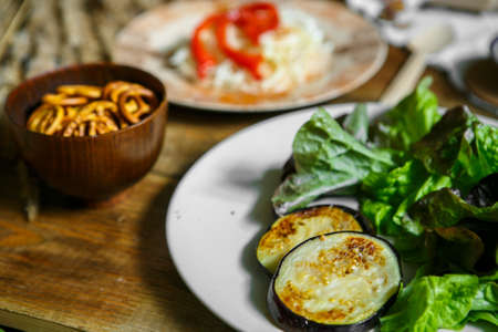 Healthy food in the village with natural products on wooden table close up. Morning different ingredient eating in countryside. Natural light. Cozy, beautifully decorated tableの写真素材