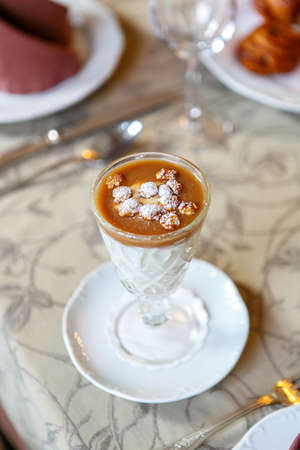 Dessert in a glass on a serving table. Serving dishes in a restaurant, cafe. Beautiful decoration of food. Close up. View from above. Singleの写真素材