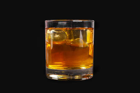A single-colored transparent cocktail, refreshing in a low glass with radiant ice cubes with a taste...