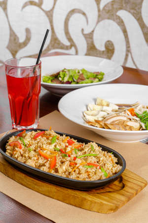 business menu Combo set dinner, Three-course dinner, rice with chicken and vegetables in a pan, salad with meat and lettuce, fo bo soup, fruit drinkの写真素材