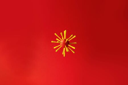 Abstract virus strain model of Coronavirus disease on red backgound with copy space. Coronaviruses influenza backdrop. Global Pandemic, COVID-19, 2019-nCov concept.の写真素材