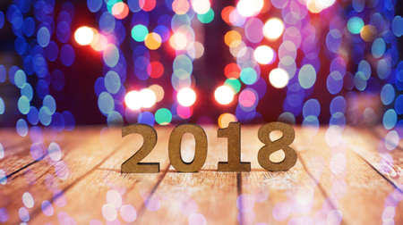 beautiful figures of wooden letters 2018 on a wooden background with a blur bokeh for the new yearの写真素材