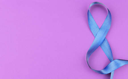 banner on a pink background with a ribbon of blue number 8 on March women dayの写真素材