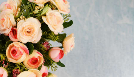 a bouquet with  roses flowers on a background in spring and summer on Mother's Day, a holiday on March 8 and Thanksgiving Dayの写真素材