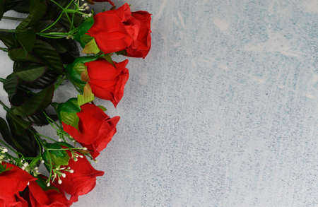 banner collage with red roses flowers and pearls on a gray background on a valentine's day celebrations on March 8の写真素材