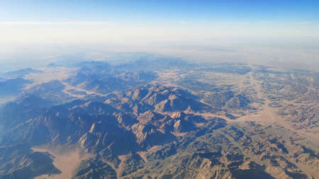 beautiful view from the window of an airplane mountains and desertの写真素材