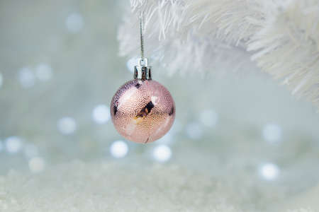 beautiful background postcard with Christmas balls ornament decorations on the snow on a Christmas tree for Christmas winter on a bokeh backgroundの写真素材