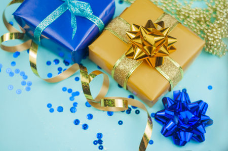 decor gift wrapping basket with a bow to congratulate on the holiday of the new year and birthday with a serpentineの写真素材