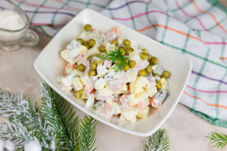 Russian salad festive Olivier with vegetables and sausageの写真素材