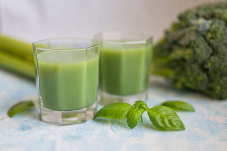 delicious healthy vegetable smoothie with basil and broccoliの写真素材
