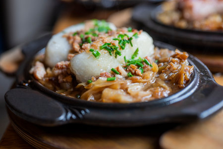 national Polish dish Kartacze from semolina with meat and onions in a restaurantの写真素材