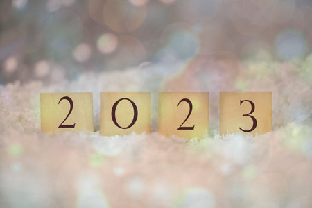 beautiful figures of wooden letters 2023 with a blur bokeh for the new yearの写真素材