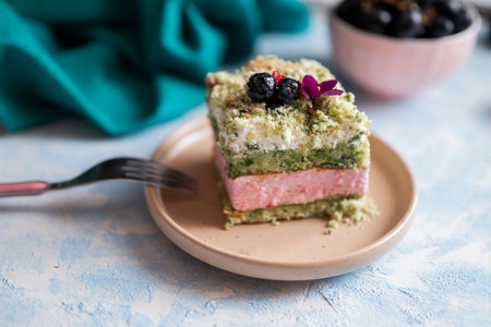 delicious sweet cake biscuit with pistachio cream with layers in a restaurantの写真素材