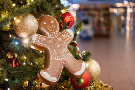 christmas tree for christmas with a garland and with decorations and with a gingerbread man