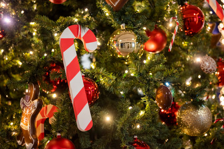 christmas tree for christmas with a garland and with decorations and candy cane santa claus