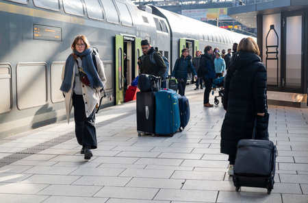 Hamburg Germany, January 28, 2023 , People walk with suitcases at the train station train stationのeditorial素材