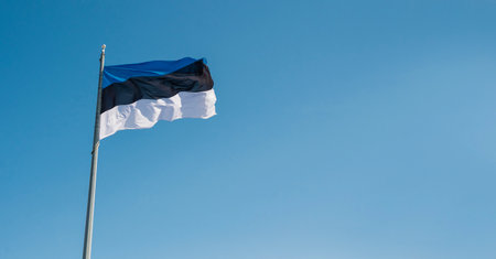 banner with a blue sky and the national flag of Estonia.