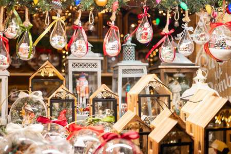 Beautiful Christmas tree decorations and balls are sold in a display case at a Christmas fairの写真素材