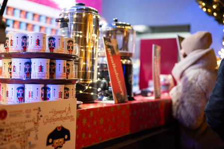 Gdansk, Poland, November 28, 2025. A Christmas market with decorations in the city center. A festive cup of mulled wineのeditorial素材