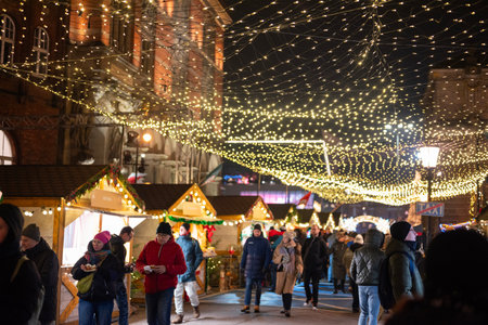 Poland, GdaÅsk, November 28, 2025, a crowd of tourists relax at the Christmas fair.のeditorial素材