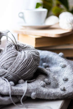 knitting on the window of a cup of coffee book hobby handmadeの写真素材