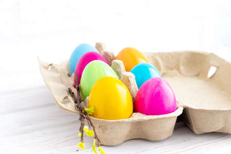 Happy Easter Eggs in a tray on a white background