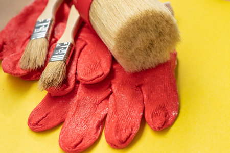 set of brushes for painting on a yellow background.の写真素材