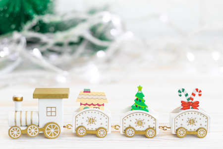 wooden toy locomotive, Christmas and New Year concept, blur, on white background.の写真素材
