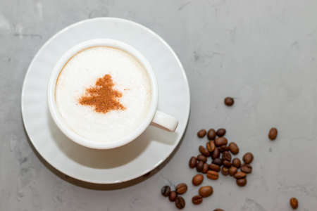 cappuccino coffee cup with cinnamon pattern, christmas drink,on concrete backgroundの写真素材