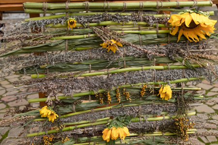a decoration woven from flowers. Creative flower arrangement. Medicinal flowers, alternative medicineの写真素材