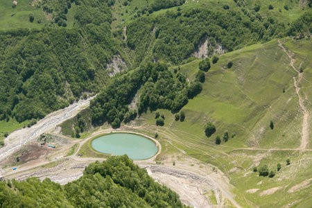 a mountain lake in the mountains, round in shape. View from above