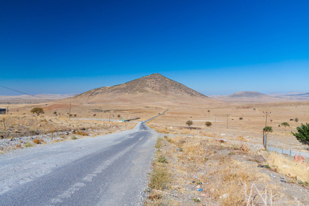 landscape with a beautiful road receding into the distanceの写真素材